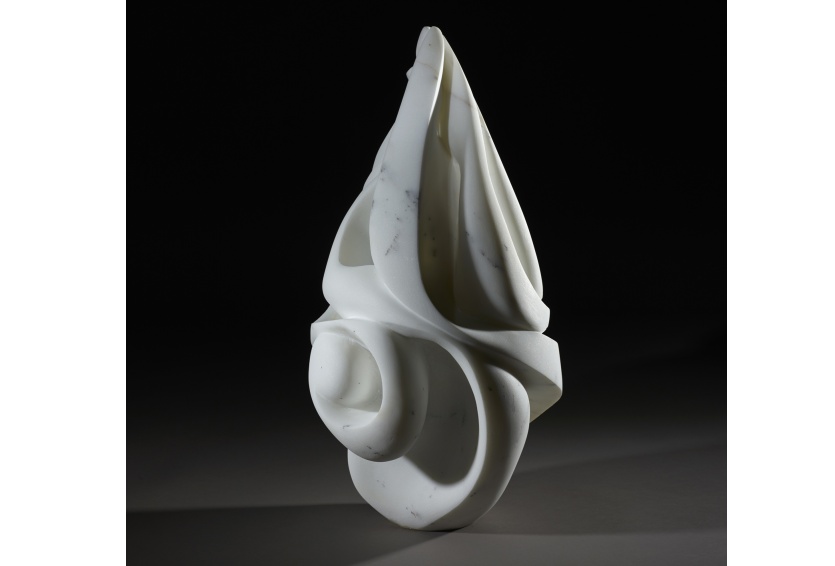 pointed white sculpture with black background